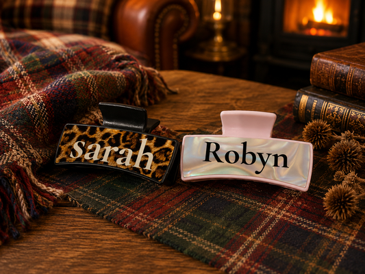 Personalised claw hair clips showing Sarah leopard print and Robyn pearlescent